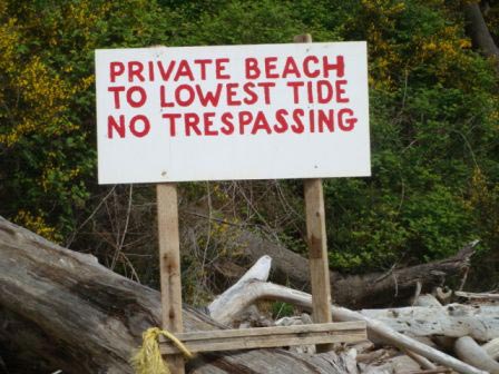 No Trespassing sign on privately owned tideland with Taylor Shellfish geoduck farm.
